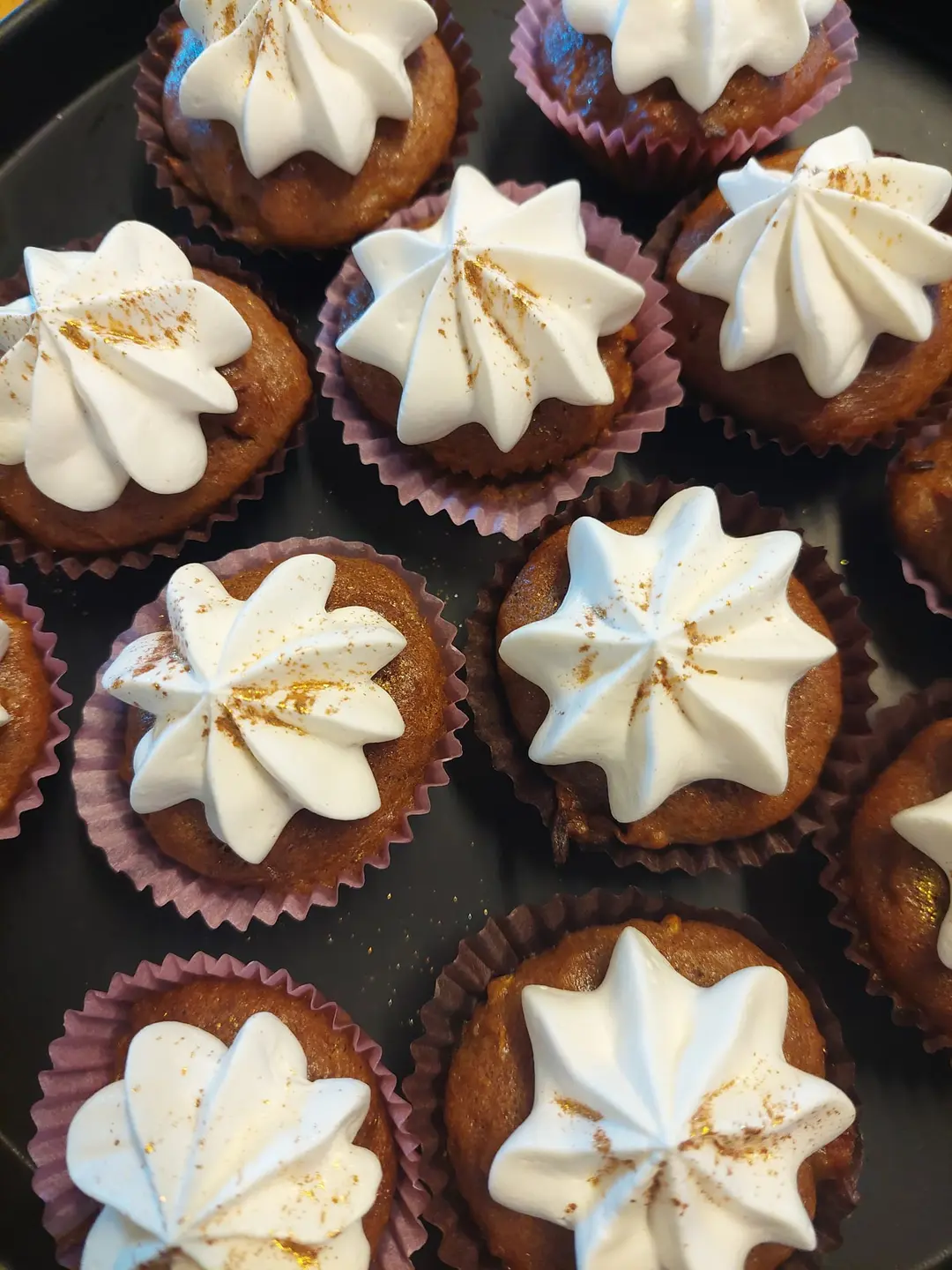 Homemade cupcakes with light-coloured frosting