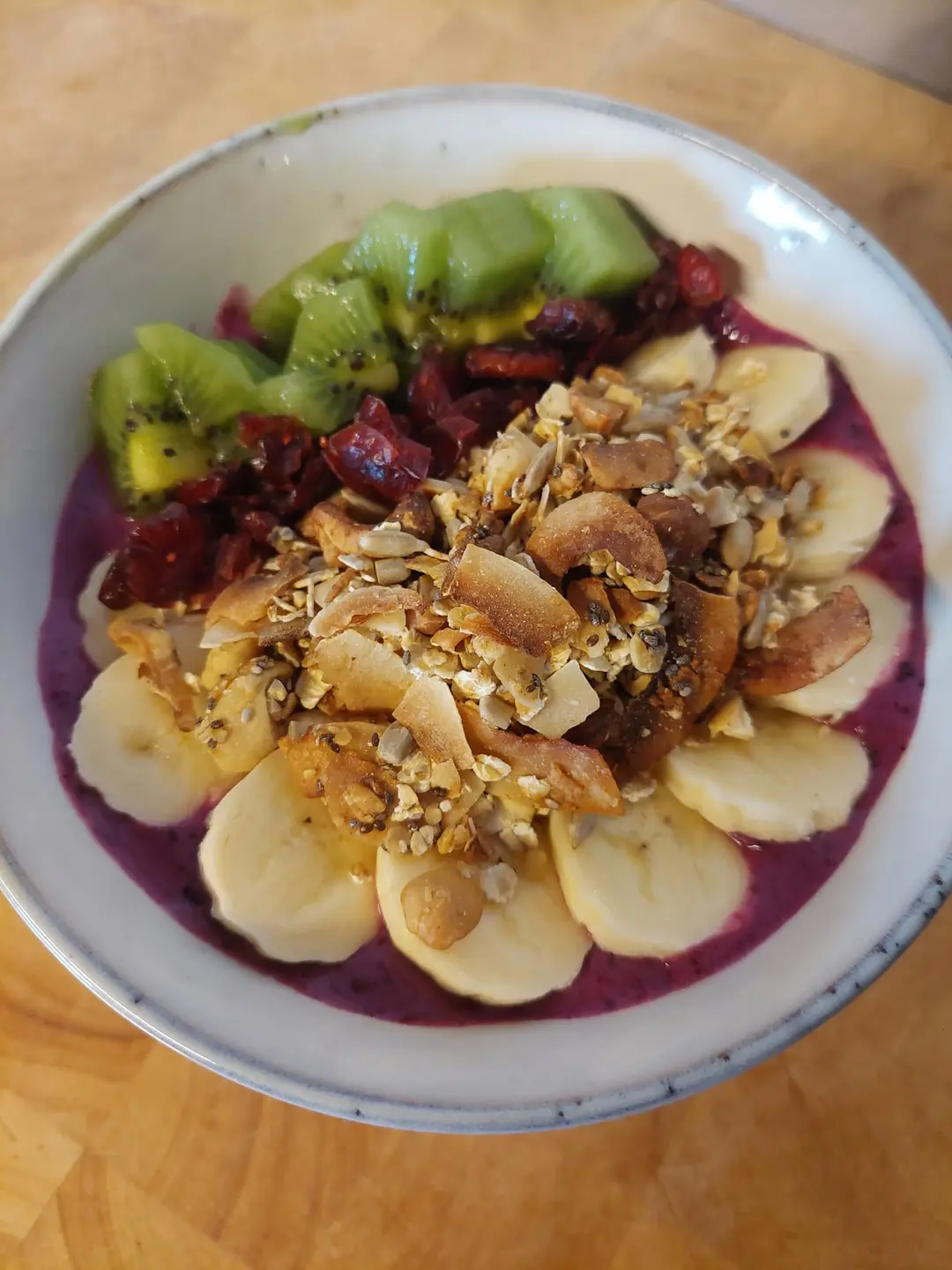Smoothie bowl with banana, kiwi, berries and granola at The Break Café
